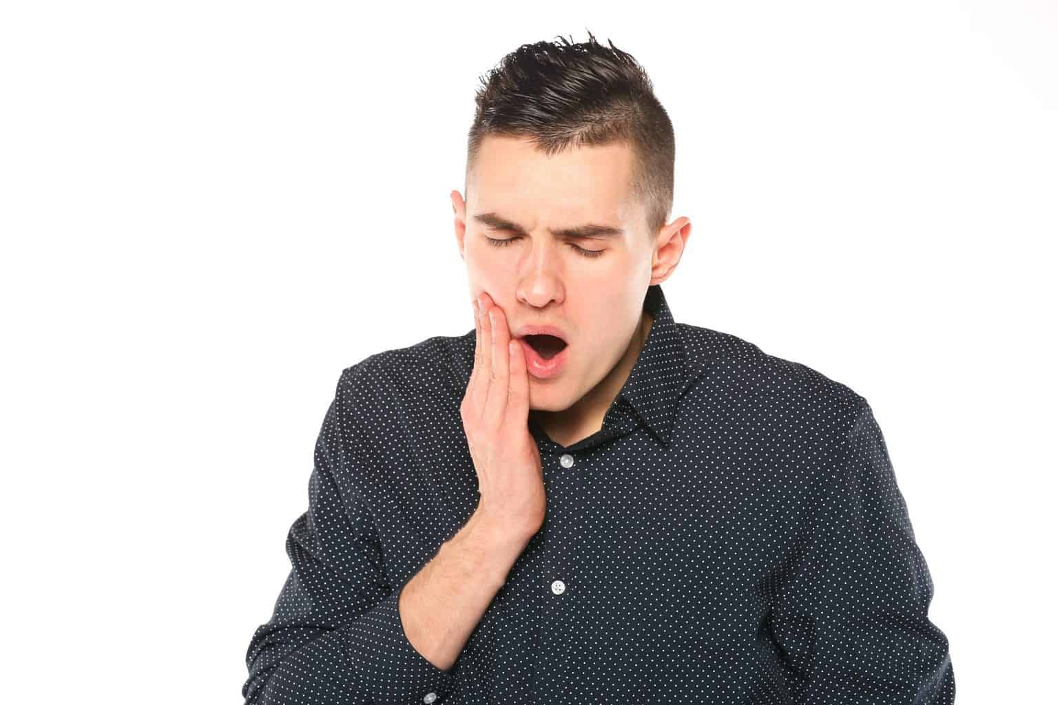 patient experiencing unbearable tooth pain