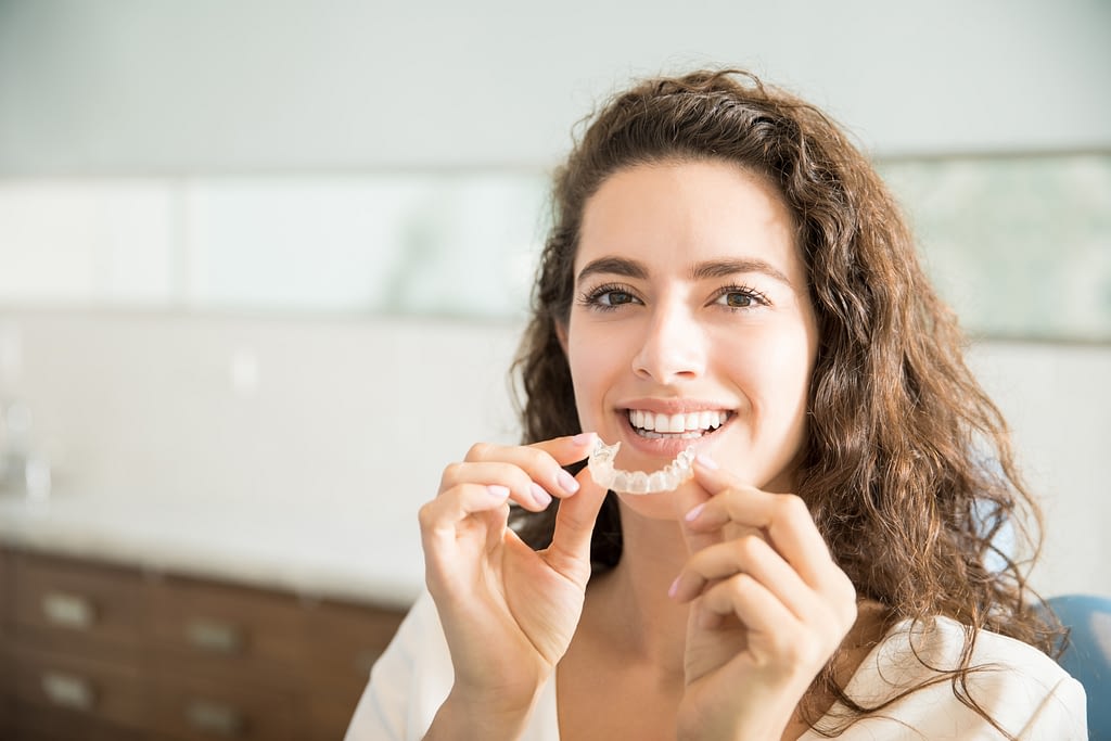 Lady smiling with upper mouthguard