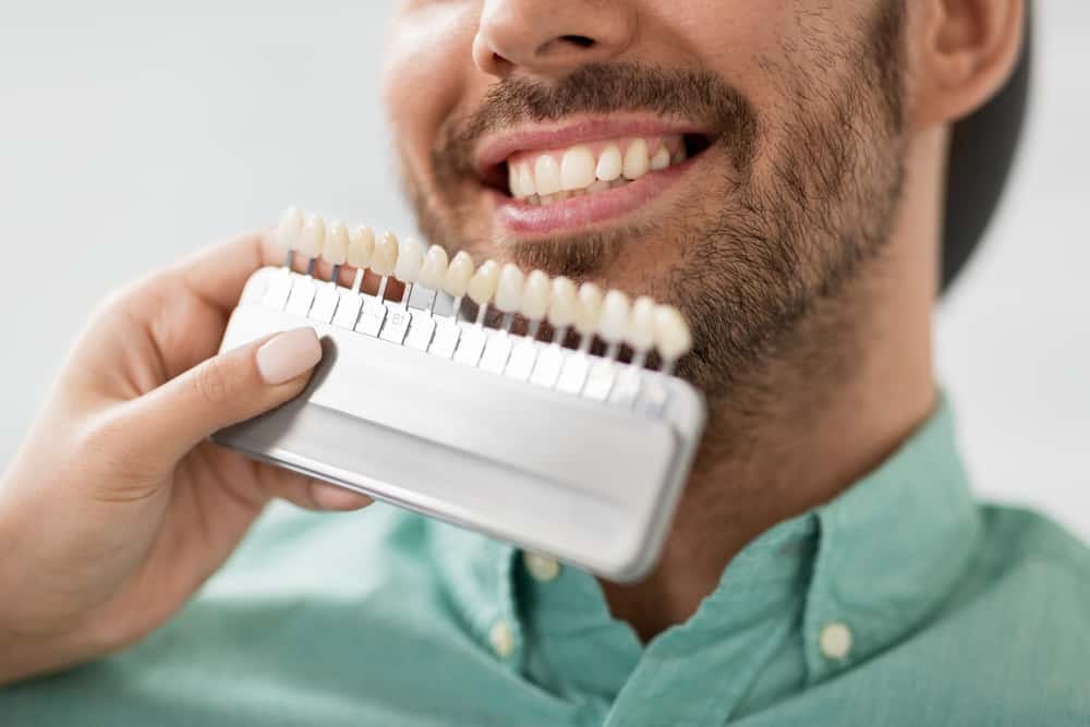 Patient undergoing porcelain veneer treatment