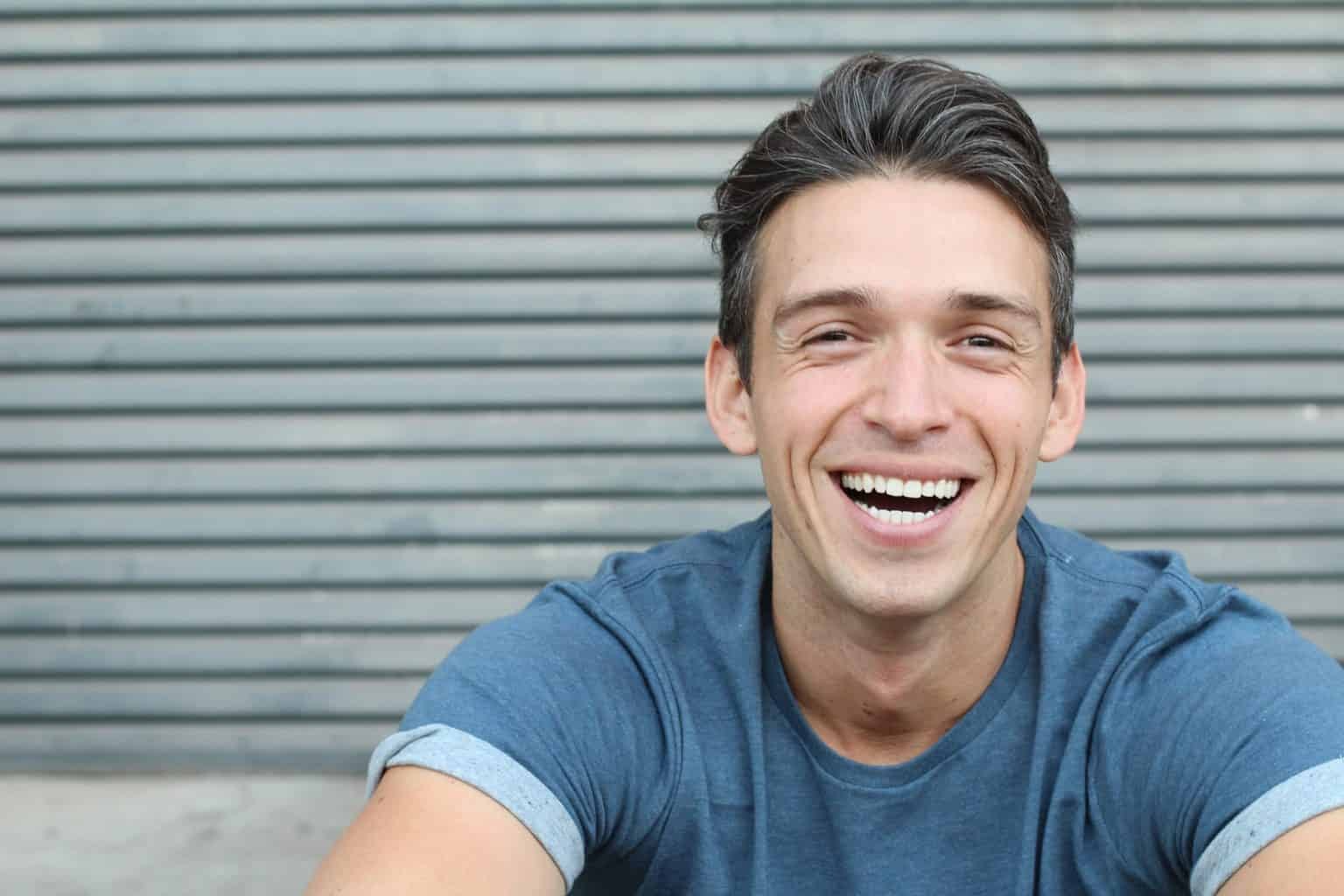 Young man smiling after cosmetic treatment